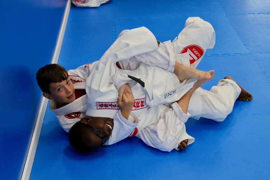 Kids drilling Jiu-Jitsu techniques