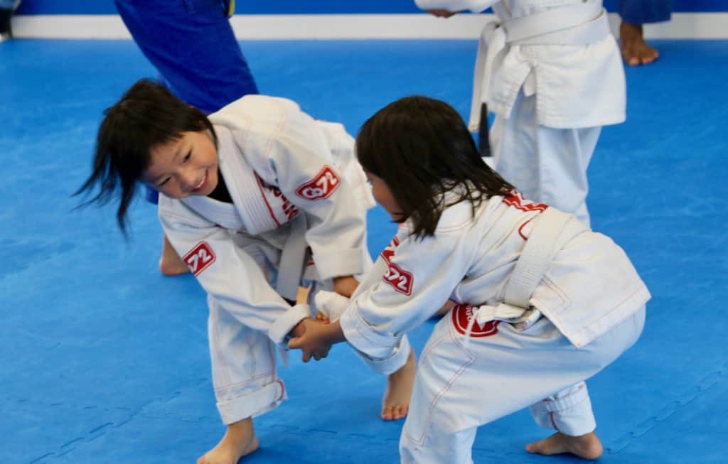 Kids drilling Jiu-Jitsu techniques